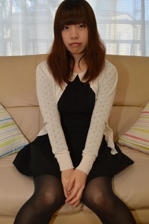 Japanese teen strips her black stockings - Photo 1