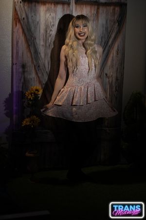 August, a gorgeous blonde trans beauty in stockings, is fucked hard by a stud in a dark, passionate night.  - Photo 2