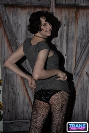 On a dark, passionate night, a black man with a huge cock fucks Elle, a stunning brunette trans woman in stockings, small tits, and a beautiful dick.  - Photo 10