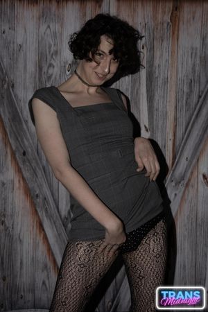 On a dark, passionate night, a black man with a huge cock fucks Elle, a stunning brunette trans woman in stockings, small tits, and a beautiful dick.  - Photo 12