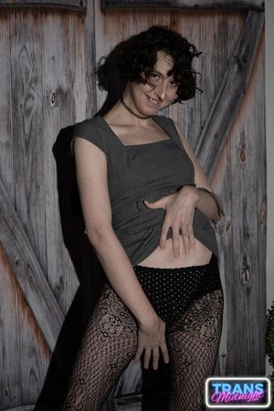 On a dark, passionate night, a black man with a huge cock fucks Elle, a stunning brunette trans woman in stockings, small tits, and a beautiful dick.  - Photo 13