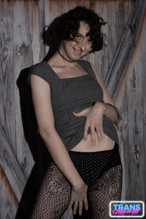 On a dark, passionate night, a black man with a huge cock fucks Elle, a stunning brunette trans woman in stockings, small tits, and a beautiful dick.  - Photo 14