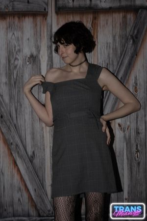 On a dark, passionate night, a black man with a huge cock fucks Elle, a stunning brunette trans woman in stockings, small tits, and a beautiful dick.  - Photo 3