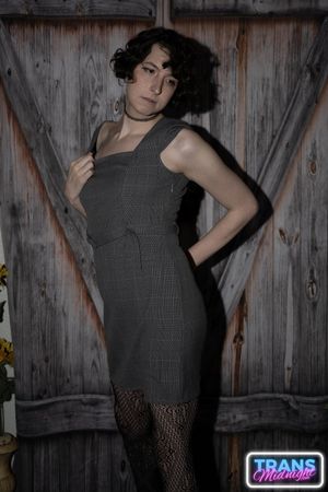 On a dark, passionate night, a black man with a huge cock fucks Elle, a stunning brunette trans woman in stockings, small tits, and a beautiful dick.  - Photo 5