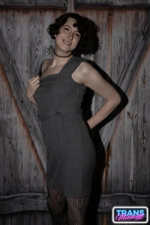 On a dark, passionate night, a black man with a huge cock fucks Elle, a stunning brunette trans woman in stockings, small tits, and a beautiful dick.  - Photo 6