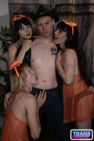 Cailey, Dixie, and Nyxi, hot transsexuals, fuck each other's asses with their hard cocks on Halloween, pleasing a lucky guy - Photo 343